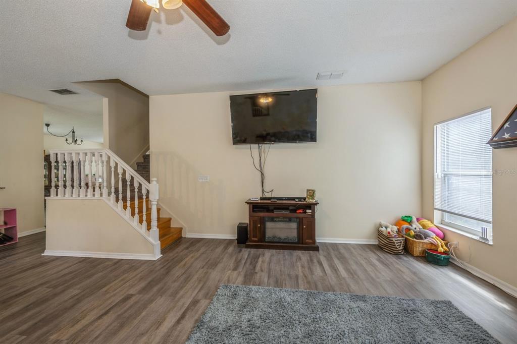 502 Freeman Street Longwood, FL 32750 - Photo 7 of 21 a living room with furniture and a flat screen tv