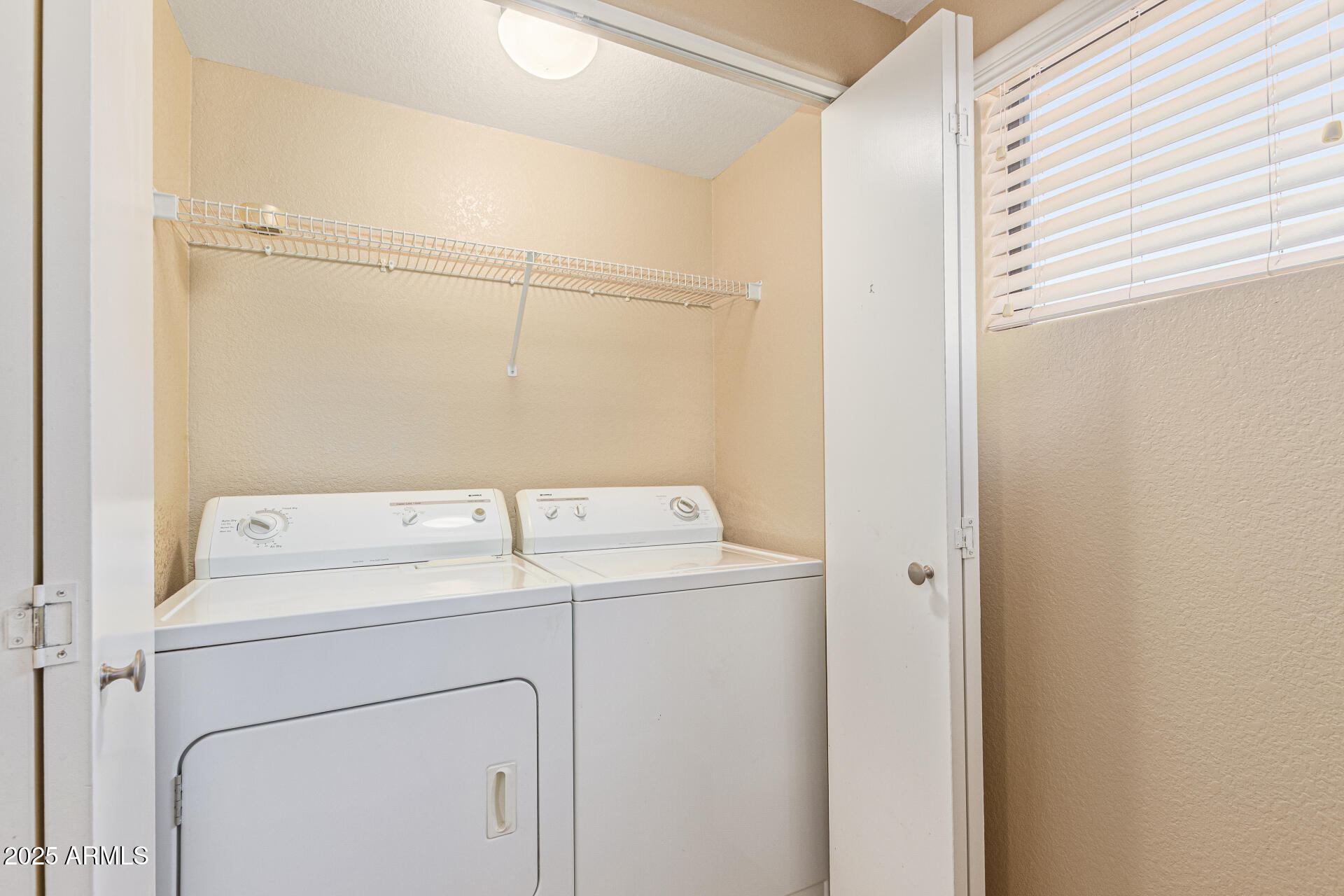 3434 East Baseline Road, Unit 331 Phoenix, AZ 85042 - Photo 16 of 37 a utility room with dryer and washer