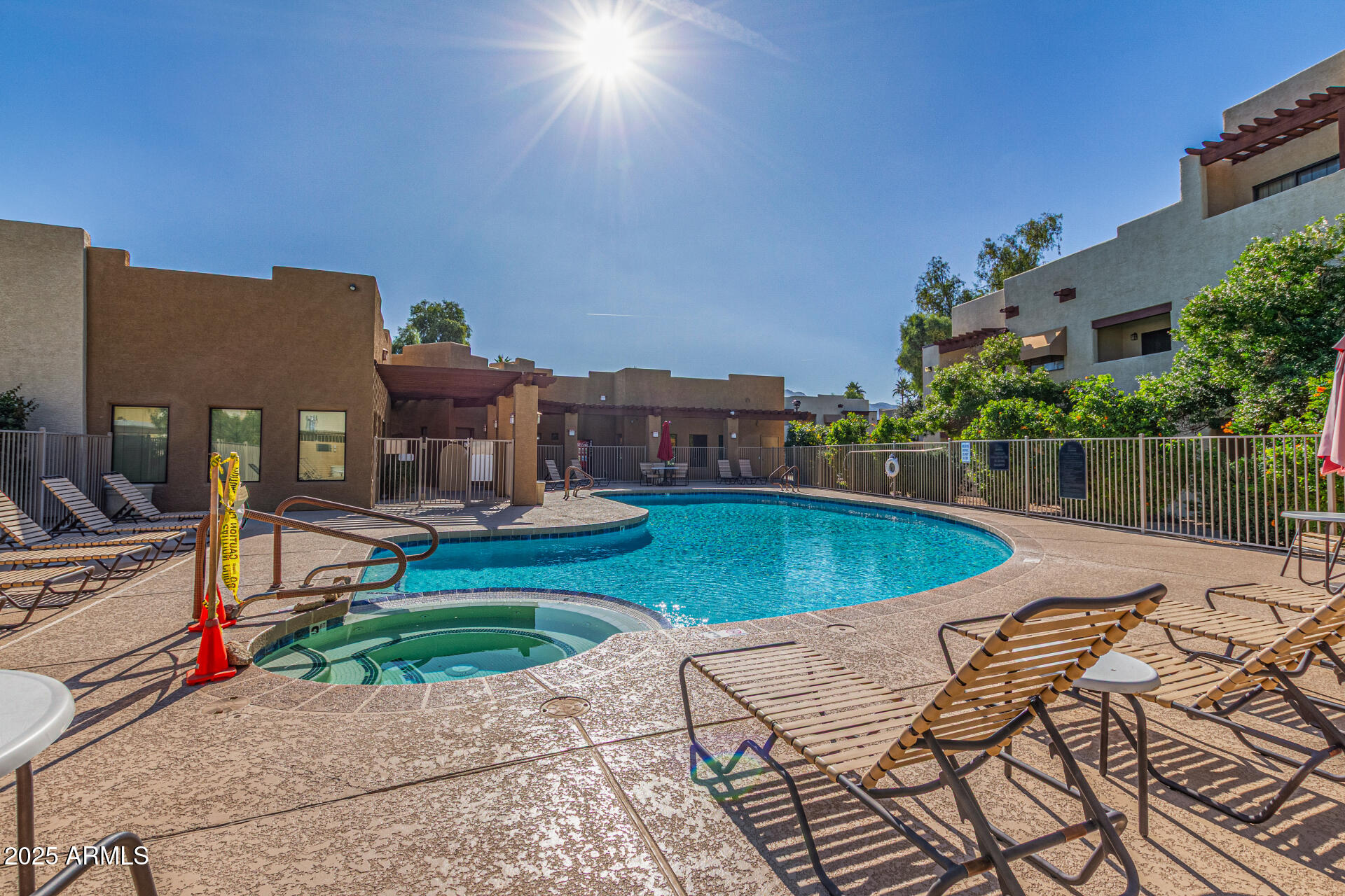 3434 East Baseline Road, Unit 331 Phoenix, AZ 85042 - Photo 21 of 37 a view of a swimming pool with a patio