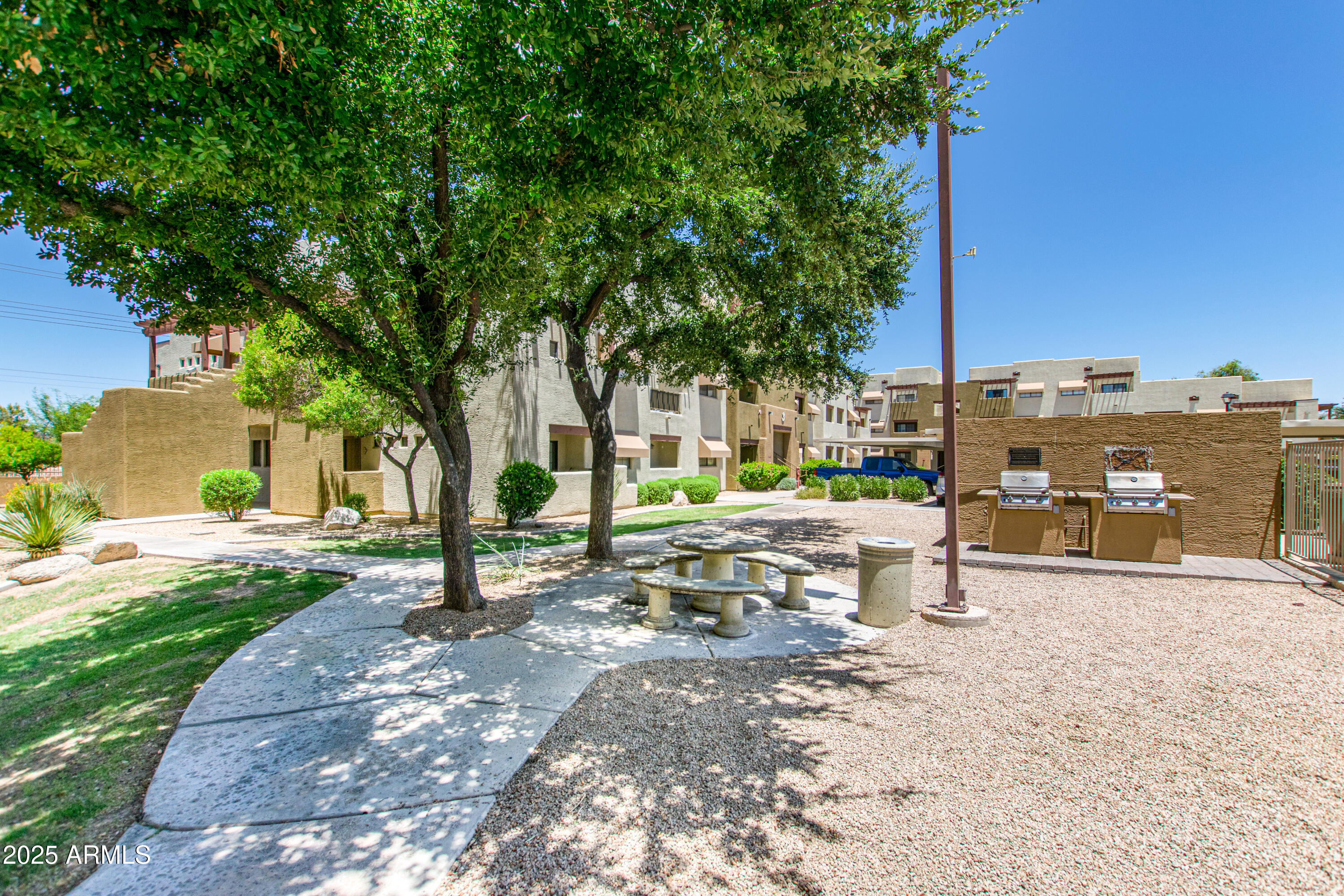 3434 East Baseline Road, Unit 331 Phoenix, AZ 85042 - Photo 27 of 37 a view of a backyard with a sitting area