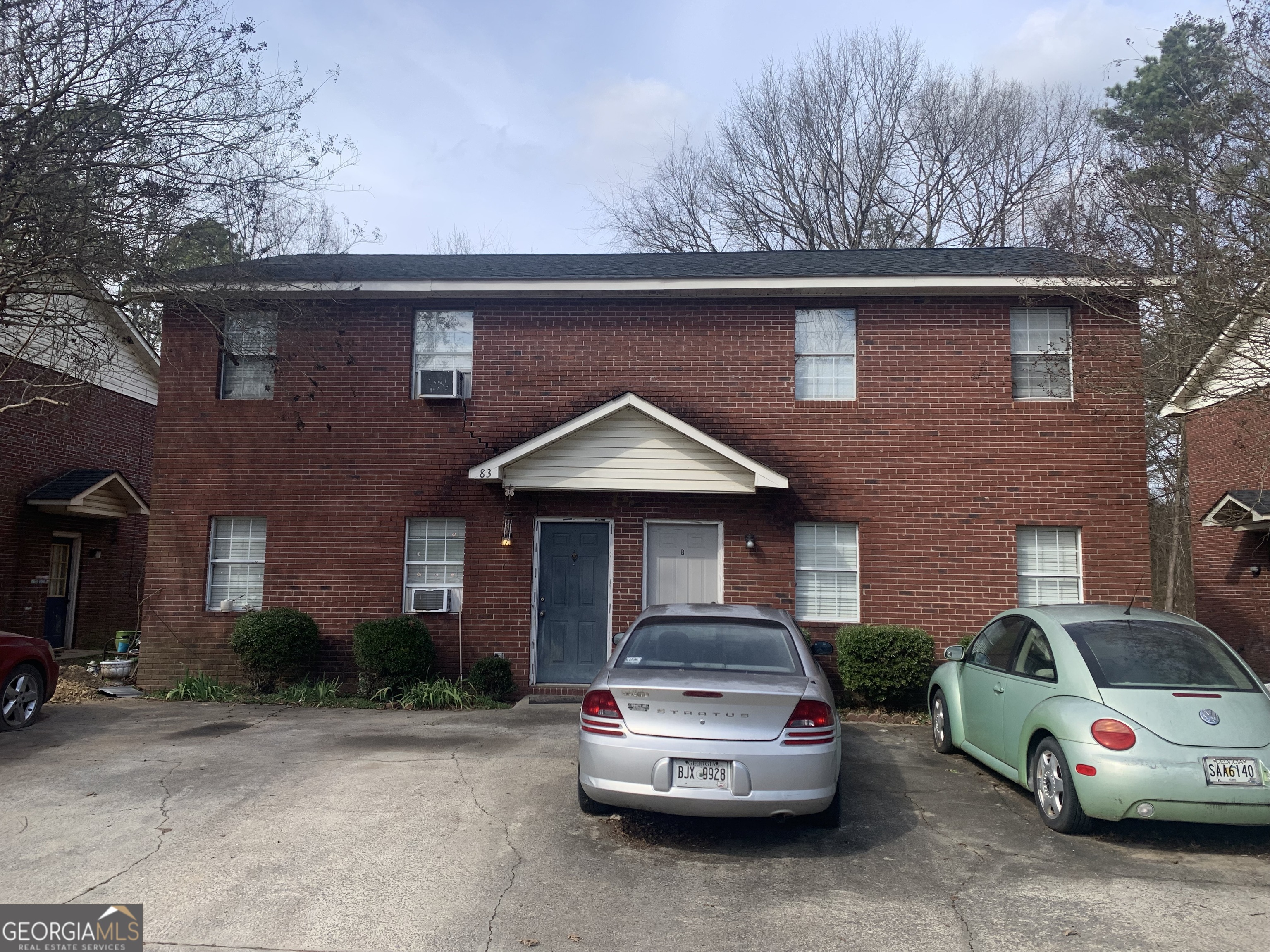 301 B Bert Road Northeast Rome, GA 30161 - Photo 3 of 6 a car parked in front of a brick house