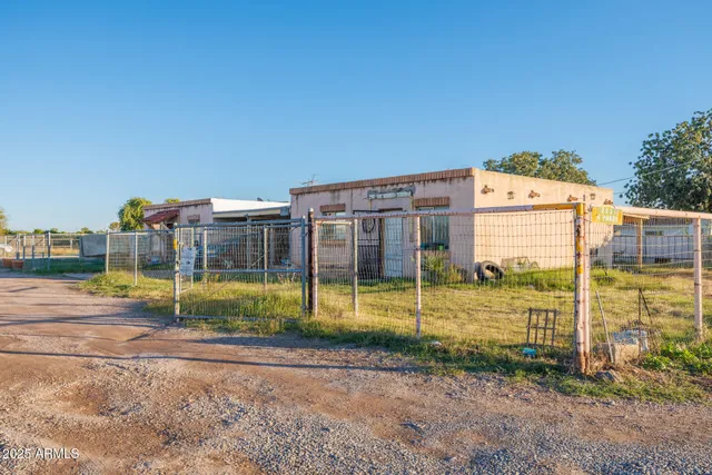 a view of a swimming pool with a yard
