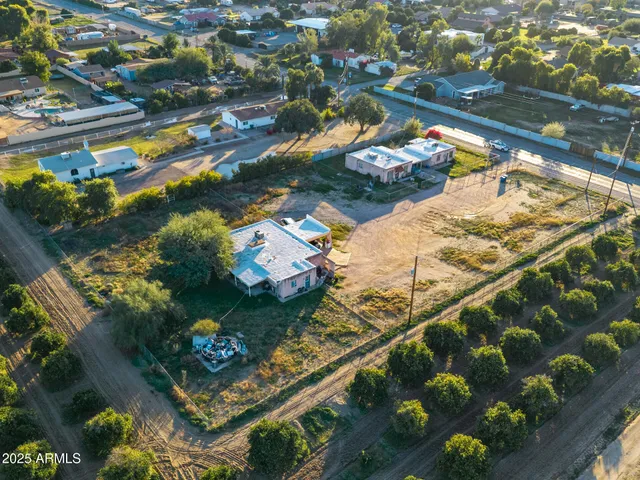 an aerial view of residential building and ocean view