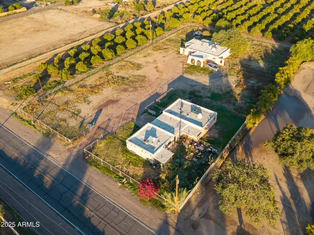 an aerial view of residential houses with outdoor space