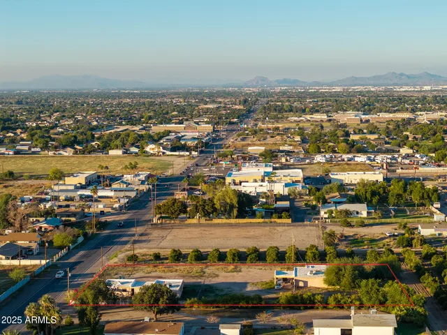 an aerial view of residential building and lake