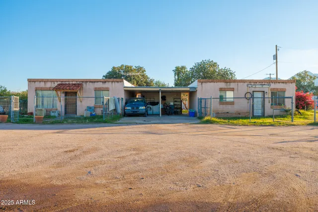 a view of house with outdoor space and swimming pool