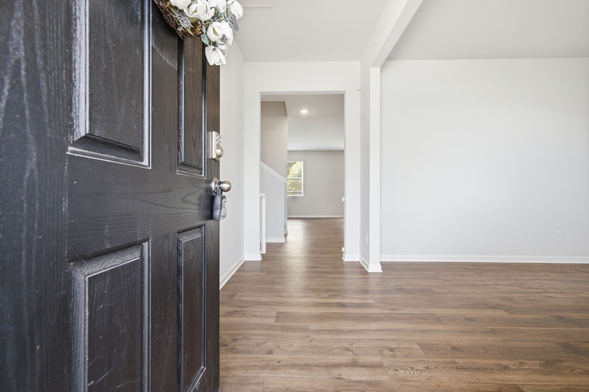 514 Ash Street Lebanon, TN 37087 - Photo 9 of 37 a view of a hallway with wooden floor