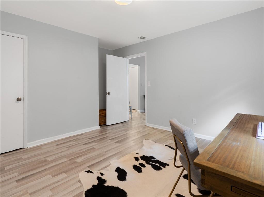 6851 Roswell Road, Unit H26 Atlanta, GA 30328 - Photo 28 of 49 a view of a workspace with wooden floor