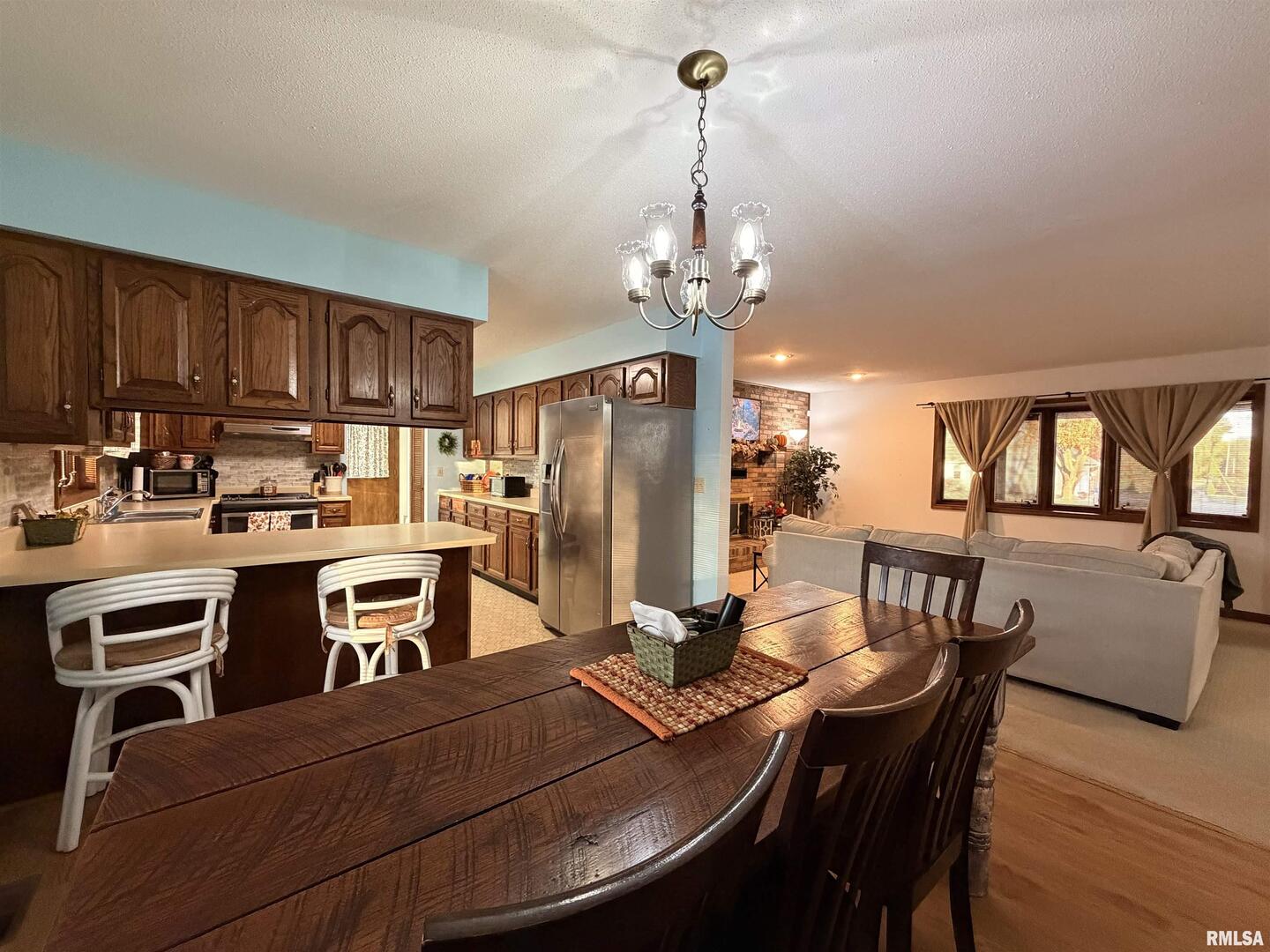 206 Daras Drive Carmi, IL 62821 - Photo 11 of 33 a view of a dining room with furniture and a chandelier