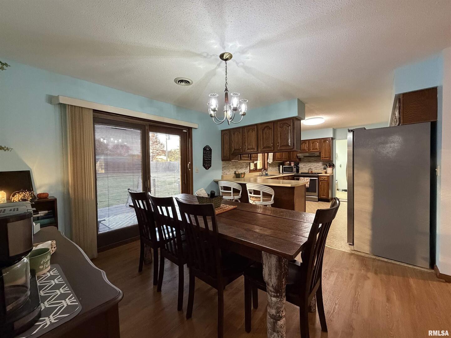206 Daras Drive Carmi, IL 62821 - Photo 12 of 33 a view of a dining room with furniture window and wooden floor