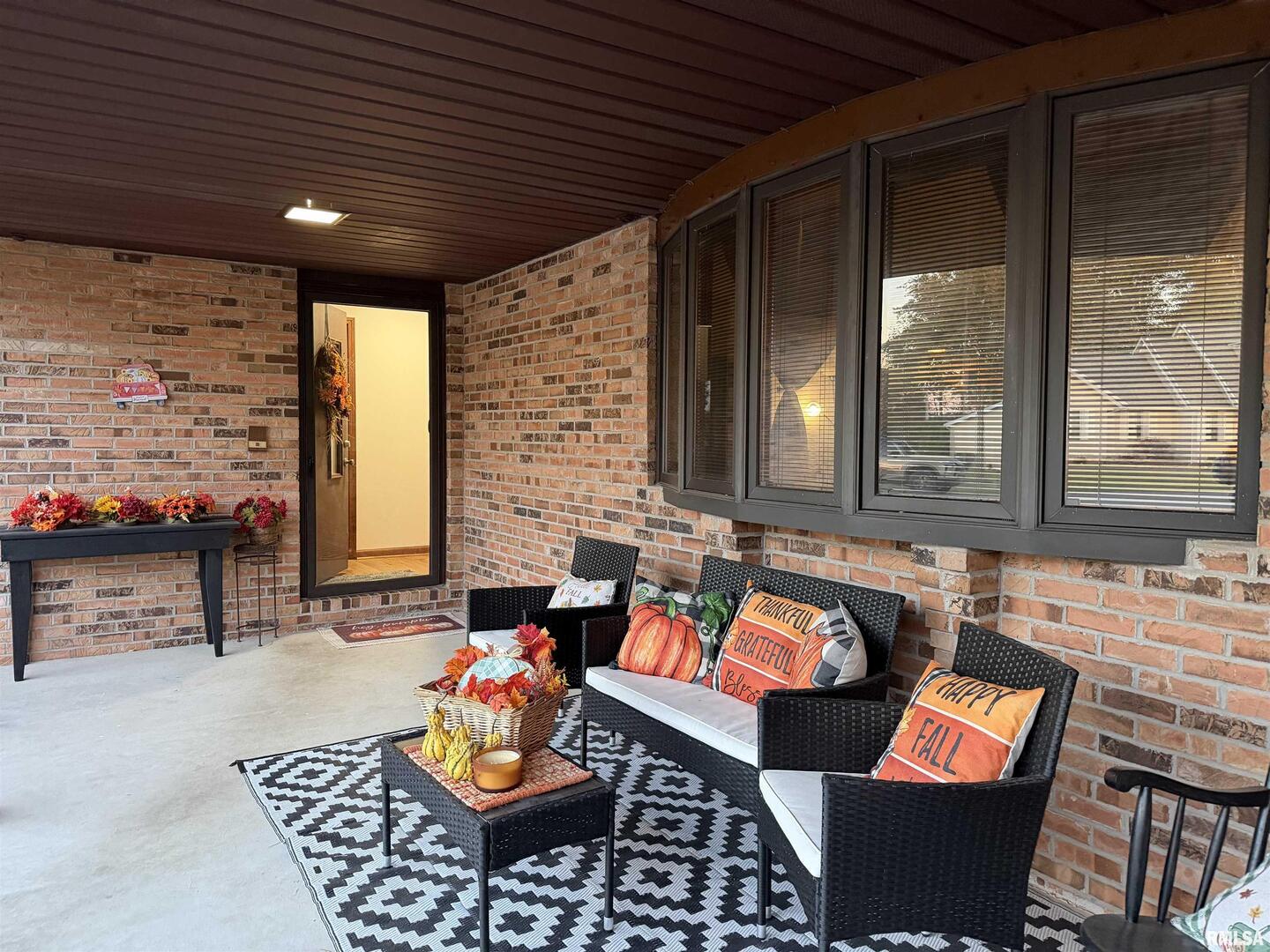 206 Daras Drive Carmi, IL 62821 - Photo 4 of 33 a outdoor living space with furniture and a fireplace