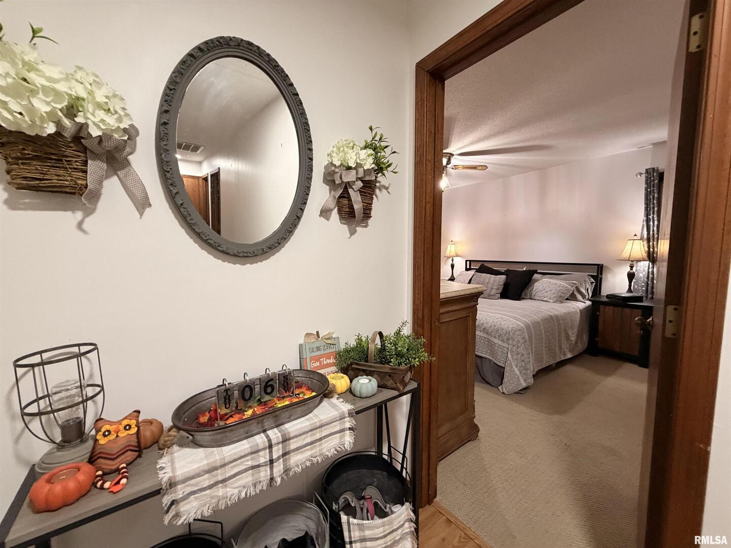 206 Daras Drive Carmi, IL 62821 - Photo 6 of 33 a bedroom with a bed and a mirror