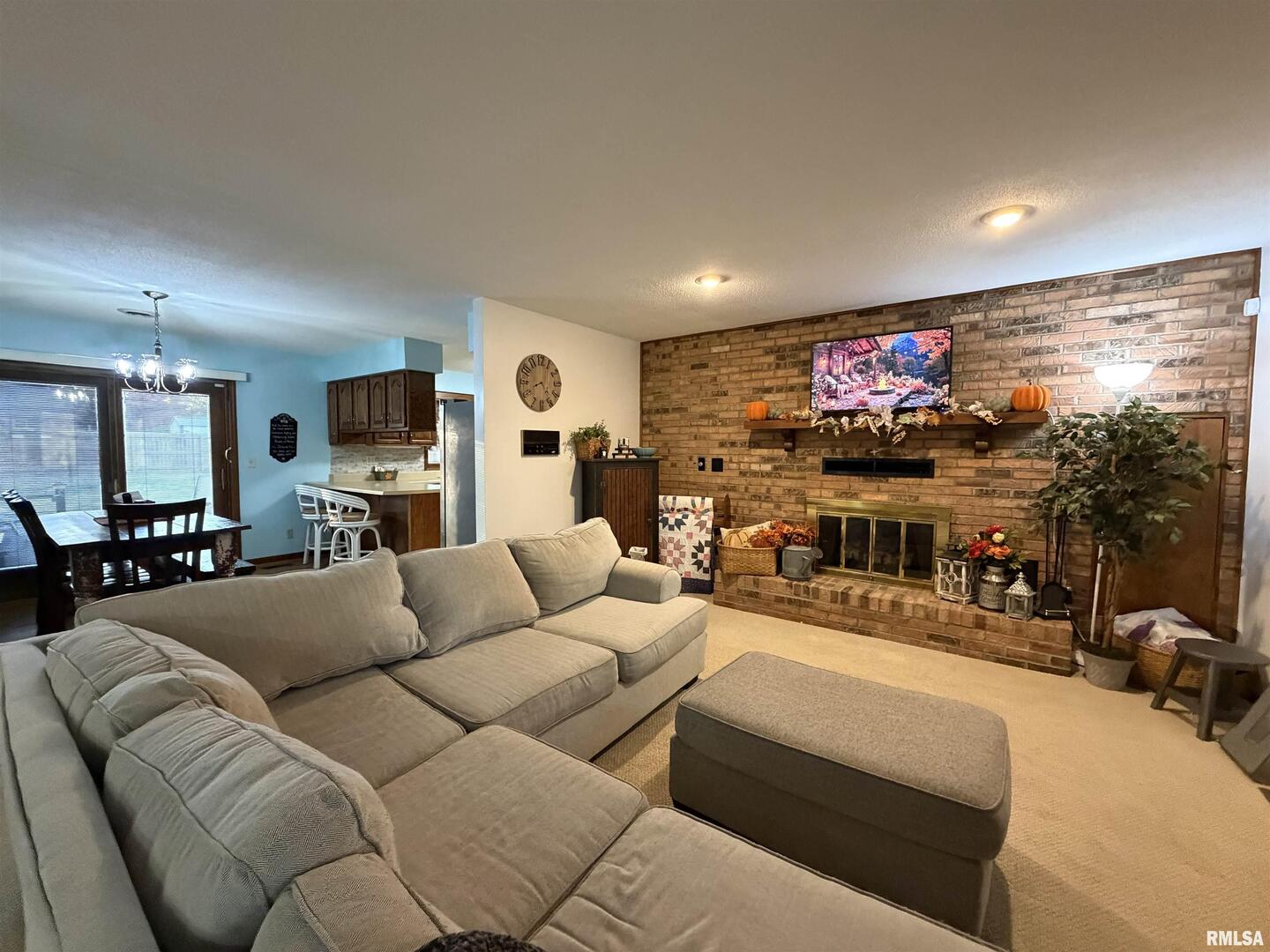 206 Daras Drive Carmi, IL 62821 - Photo 10 of 33 a living room with furniture and a flat screen tv