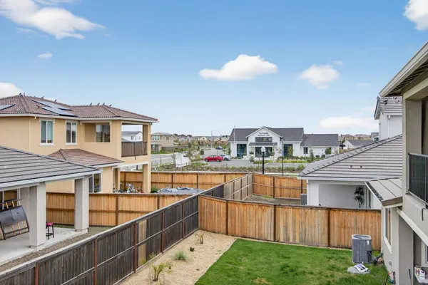 a swimming pool with outdoor seating and city view