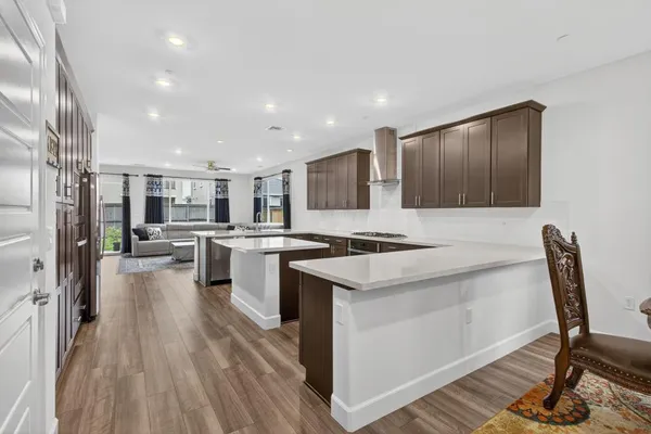 a kitchen with granite countertop a cabinets and a stove top oven