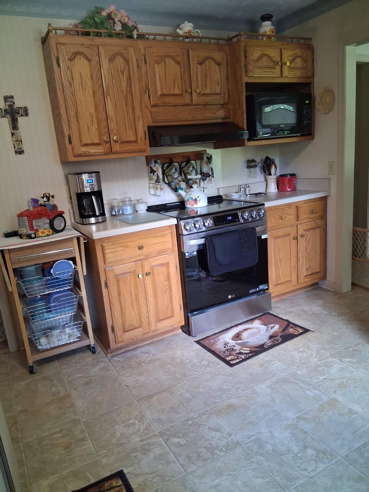 3168 Maxey Road Cedar Hill, TN 37032 - Photo 26 of 40 a kitchen with stainless steel appliances granite countertop a stove top oven a sink dishwasher and cabinets with wooden floor