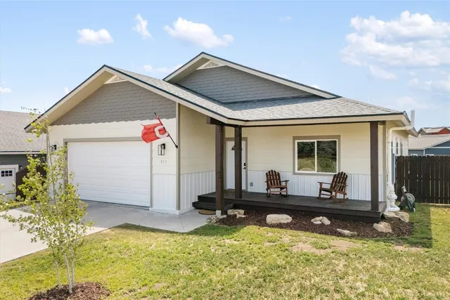 a front view of house with yard outdoor seating and barbeque oven