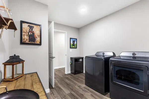 a view of a house with a yard and pathway