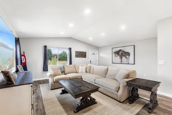 a living room with furniture and a large window