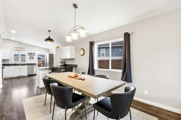 a view of a dining room with furniture window and wooden floor