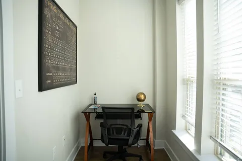 a view of a dining room with furniture and a window