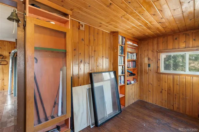 a backyard of a house with wooden fence and deck