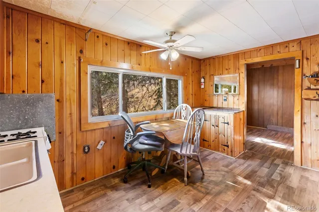 a view of a dining room with furniture and chandelier