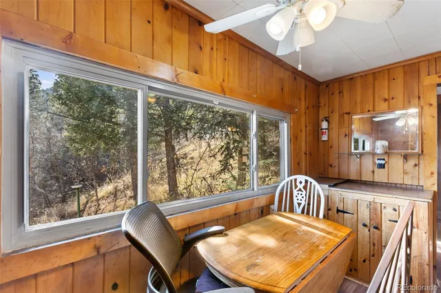 a view of a dining room with furniture window and outside view