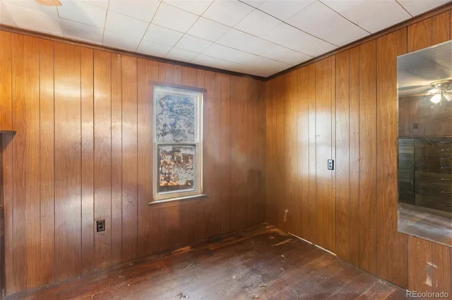 a view of an empty room with wooden door