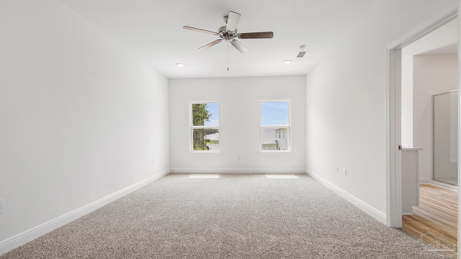 3233 Harrier Road Pace, FL 32571 - Photo 13 of 50 an empty room with a window and a ceiling fan