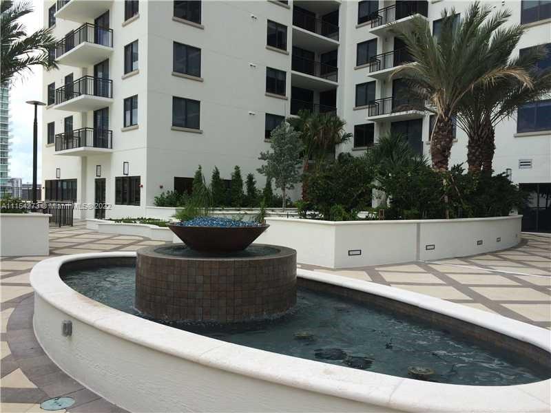 999 Southwest 1st Avenue, Unit 2502 Miami, FL 33130 - Photo 7 of 10 a view of building with yard