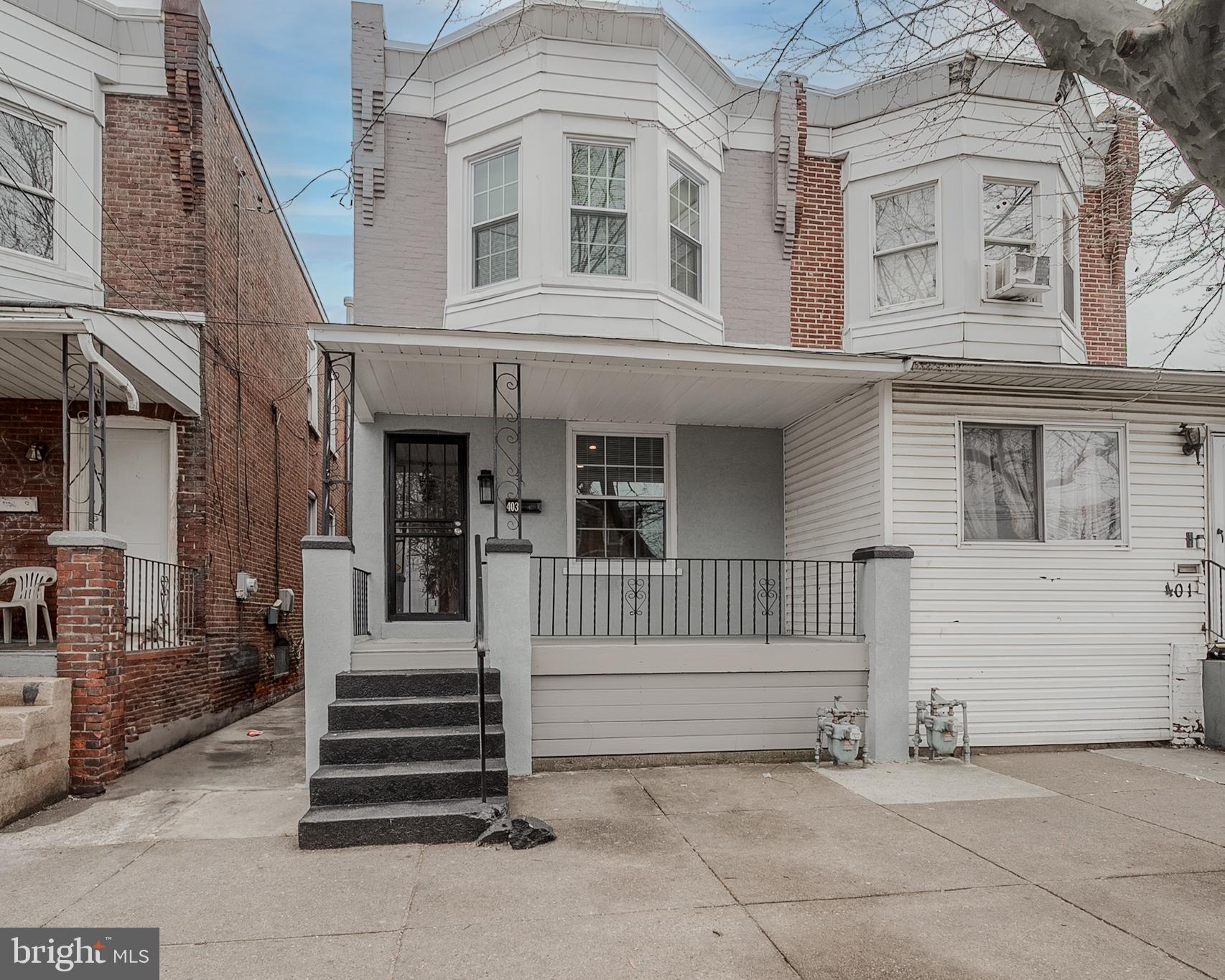 a view of a house with a fence and a stairs