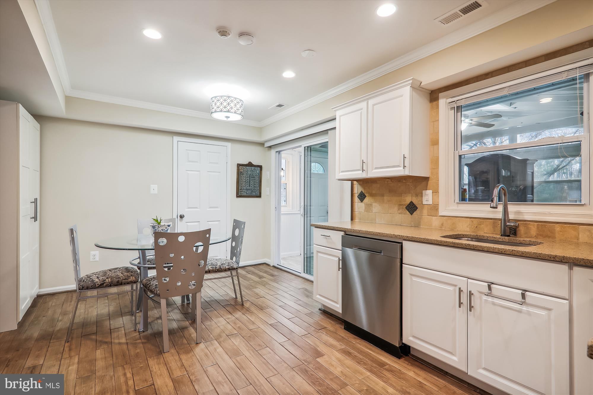 2804 Hewitt Avenue Silver Spring, MD 20906 - Photo 11 of 34 Table space area with access to sunroom