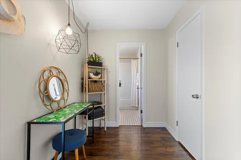 a view of a livingroom with furniture and wooden floor