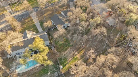 a front view of house with yard and trees