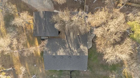 a backyard of a house with lots of green space and fountain