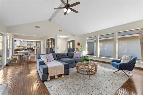 a living room with furniture and a rug