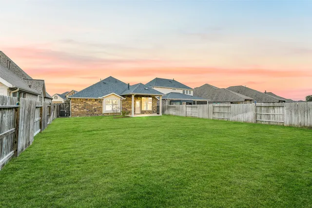 a view of a yard in front of a house with a yard
