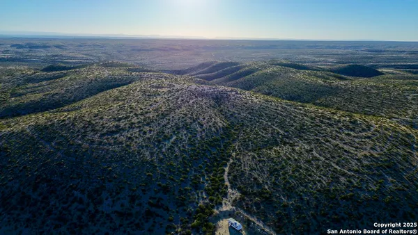 a view of a field with an outdoor space
