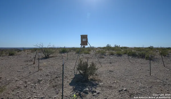 a view of a yard with snow on the road