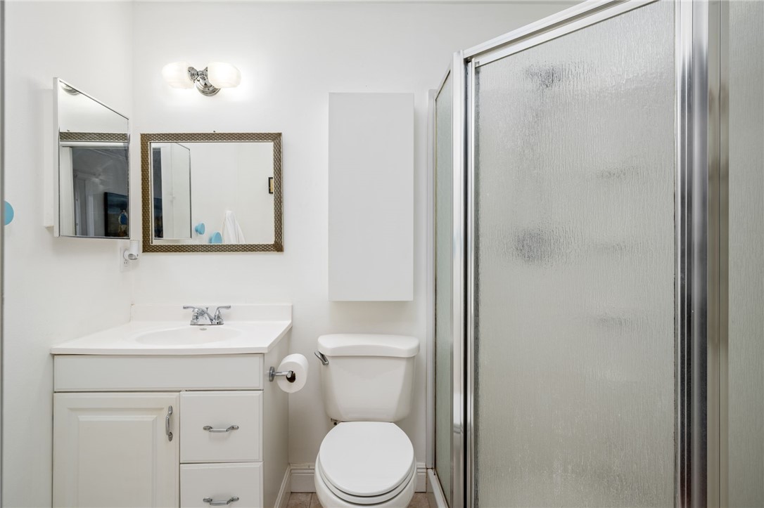 3496 1st Street Southwest Vero Beach, FL 32968 - Photo 21 of 30 a bathroom with a toilet a sink and a mirror