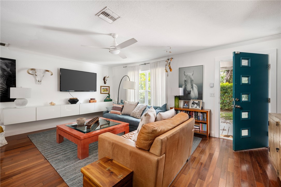 3496 1st Street Southwest Vero Beach, FL 32968 - Photo 22 of 30 a living room with furniture and a flat screen tv