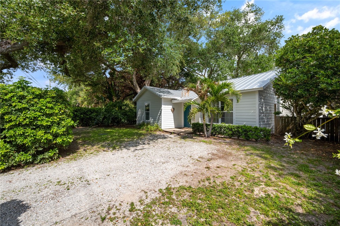 3496 1st Street Southwest Vero Beach, FL 32968 - Photo 24 of 30 a view of a house with a yard and large trees