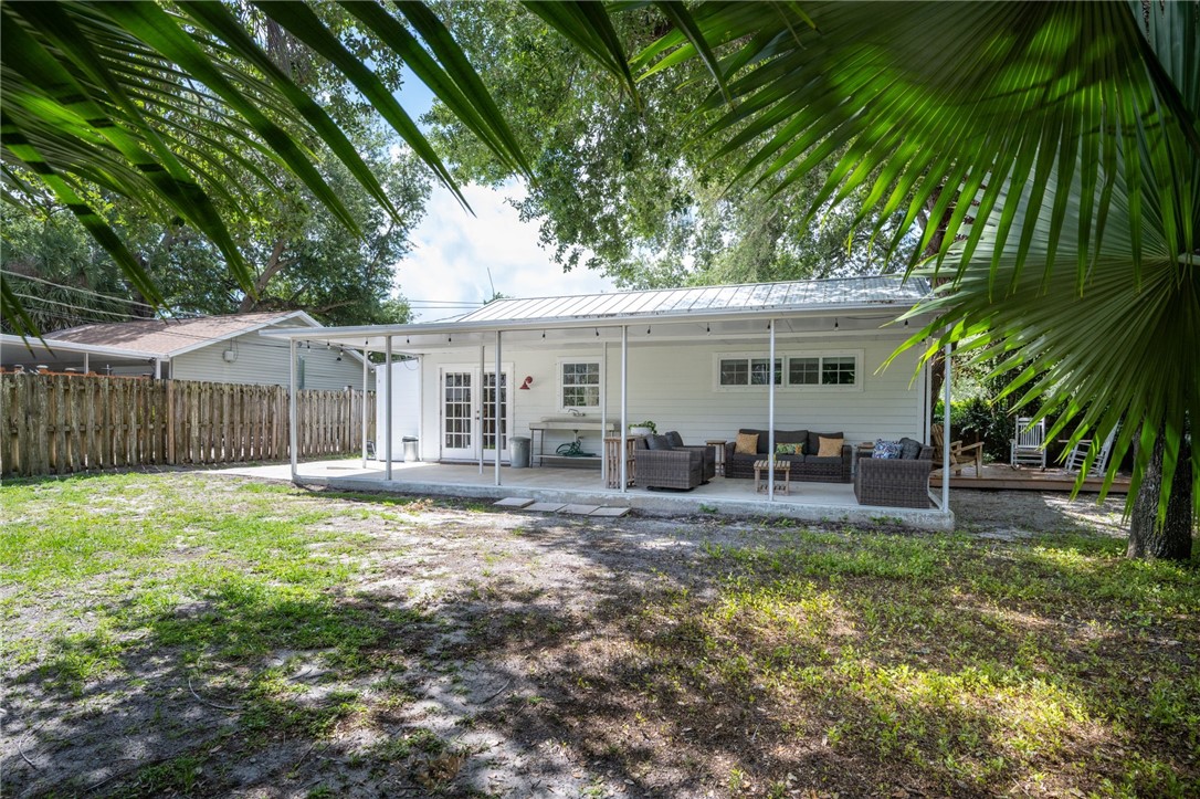 3496 1st Street Southwest Vero Beach, FL 32968 - Photo 29 of 30 a view of a house with backyard and a tree