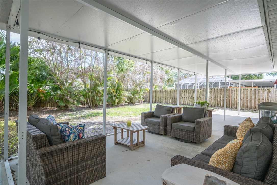 3496 1st Street Southwest Vero Beach, FL 32968 - Photo 3 of 30 a living room with furniture and a large window