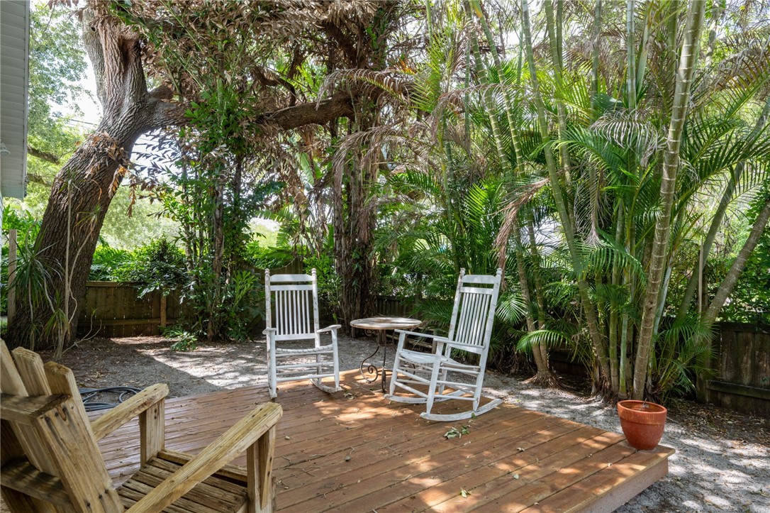 3496 1st Street Southwest Vero Beach, FL 32968 - Photo 4 of 30 a view of a chairs and table in the patio