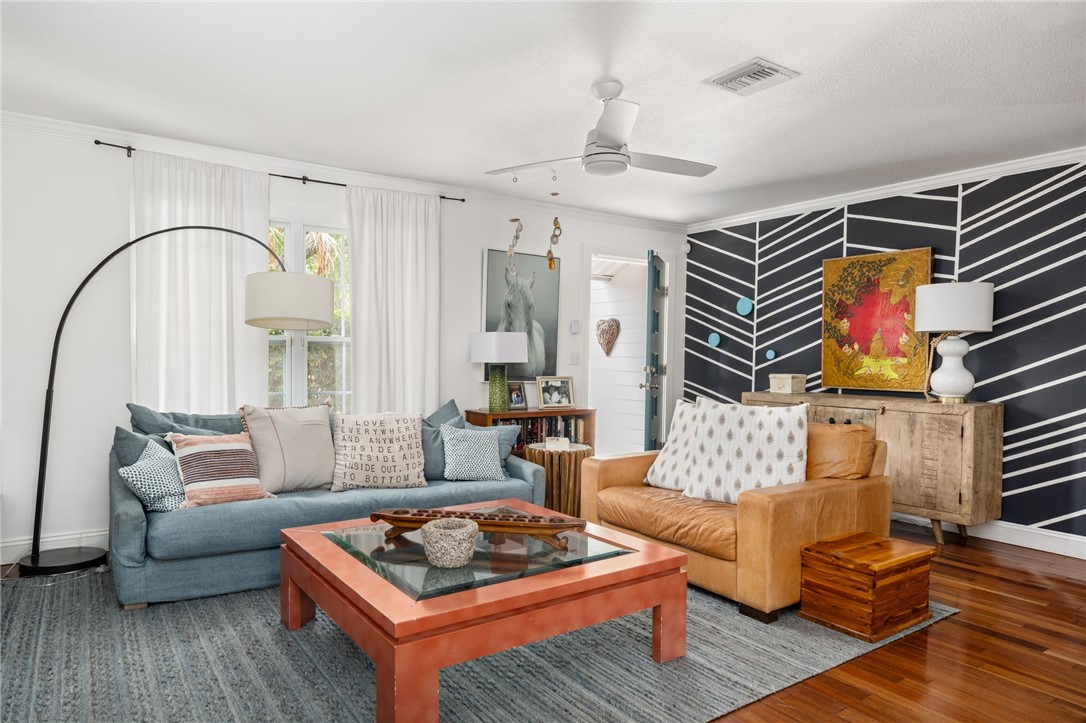 3496 1st Street Southwest Vero Beach, FL 32968 - Photo 5 of 30 a living room with furniture a rug and a window