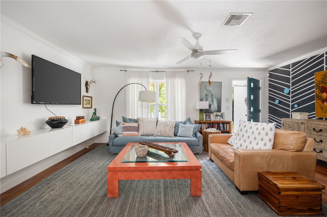 3496 1st Street Southwest Vero Beach, FL 32968 - Photo 6 of 30 a living room with furniture and a flat screen tv