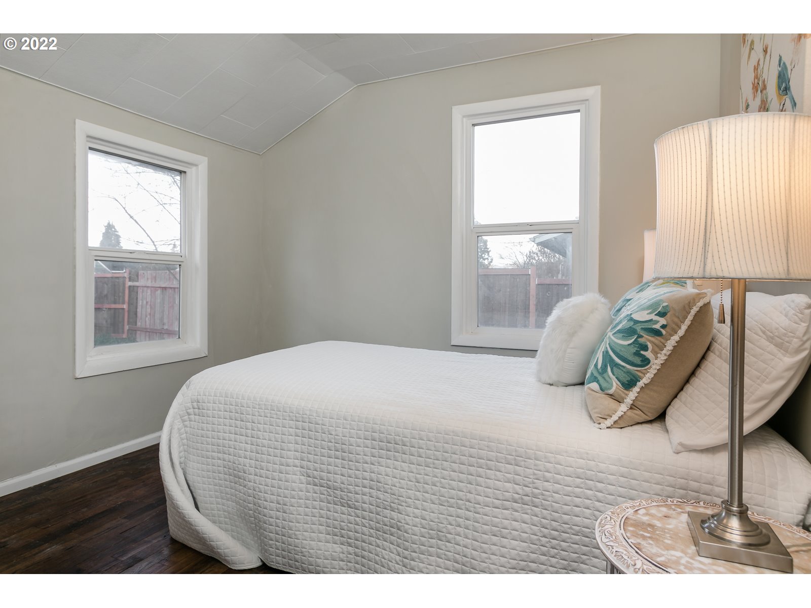 428 18th Street Springfield, OR 97477 - Photo 16 of 22 a bedroom with a bed and wooden floor