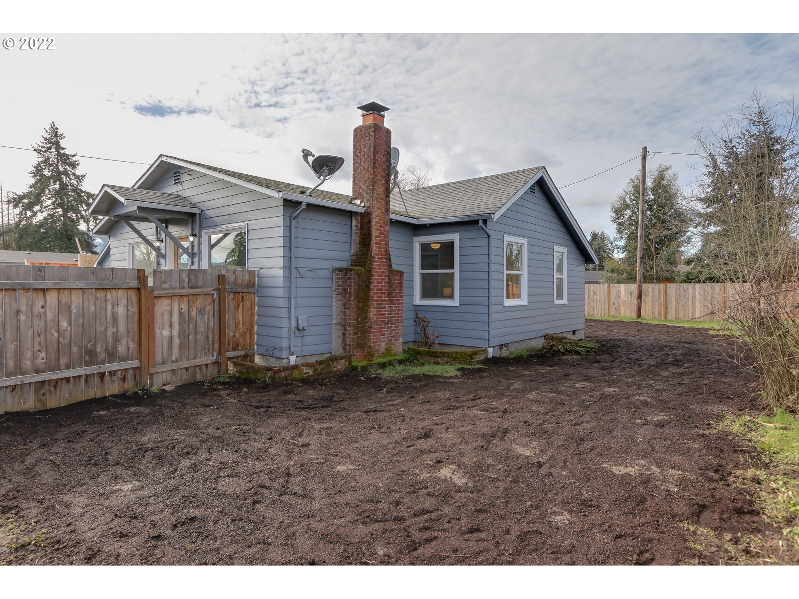 428 18th Street Springfield, OR 97477 - Photo 21 of 22 a view of a house with a yard